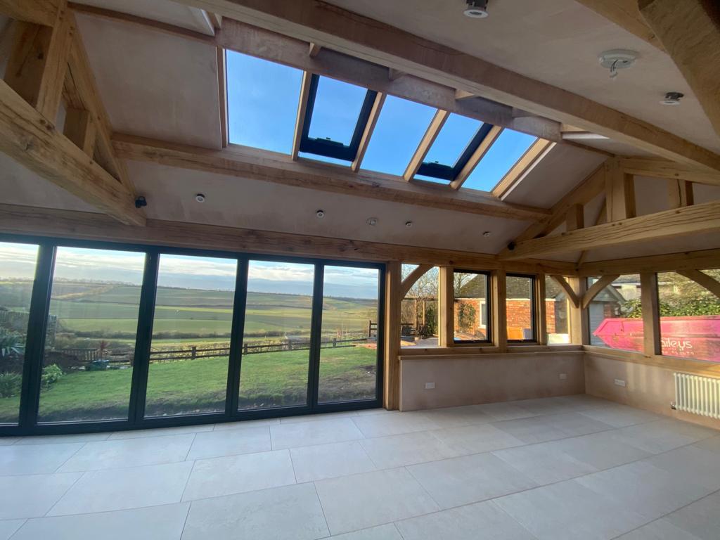 Plastered barn in Market Harborough, Leicestershire with wooden beams velux and French windows