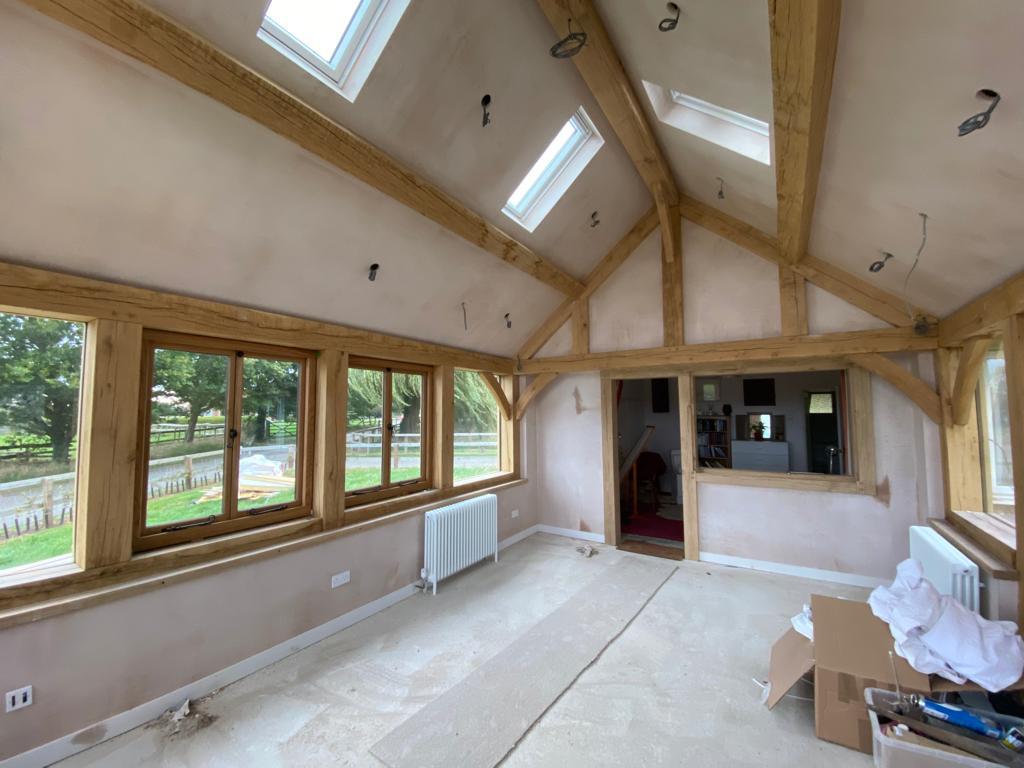 Plastered barn in Market Harborough, Leicestershire with wooden beams and windows