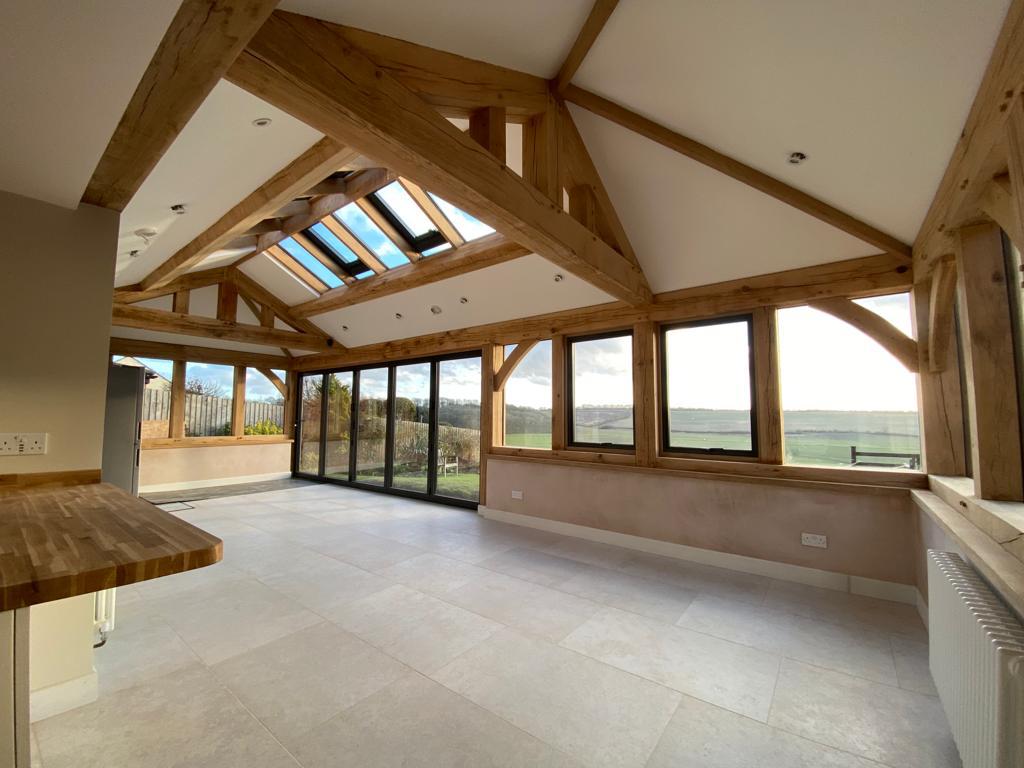 Plastered barn in Market Harborough, Leicestershire with wooden beams velux and French windows