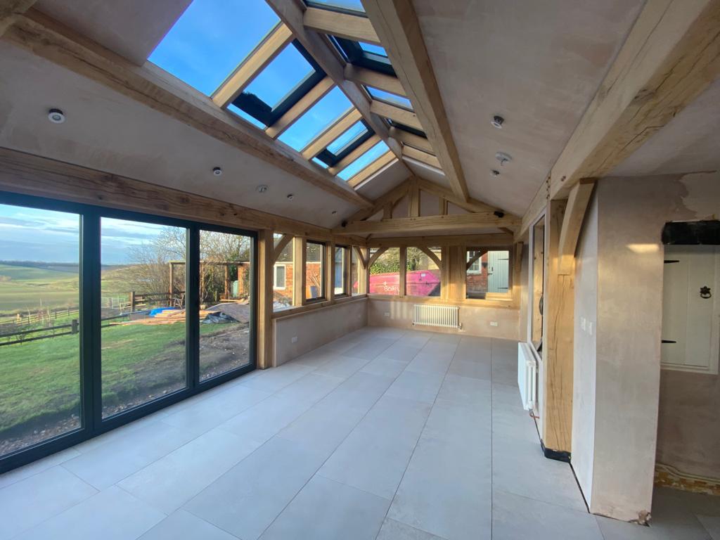 Plastered barn in Market Harborough, Leicestershire with wooden beams velux and French windows