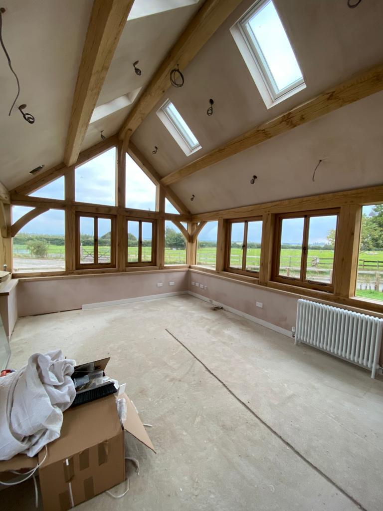 Plastered barn in Market Harborough, Leicestershire with wooden beams velux and French windows